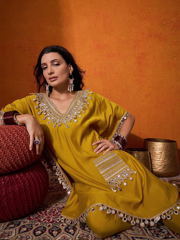 Close-up of mirror work detailing on kaftan neckline